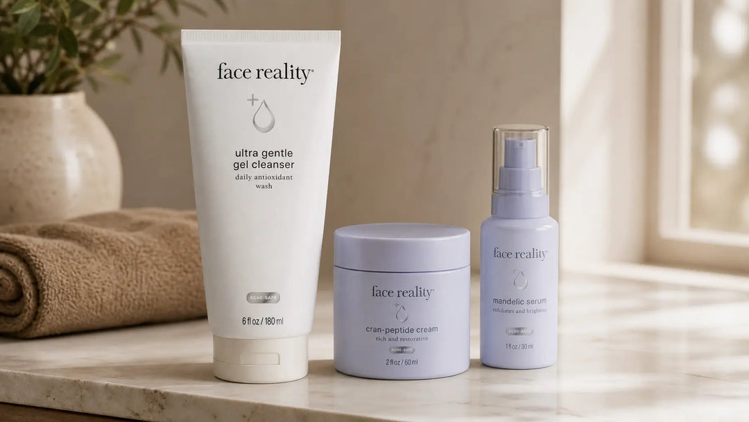 Face Reality skincare products on a vanity. Ultra Gentle Cleanser and Cran-Peptide Cream, Cleanse Face & Body Bar acne program guide