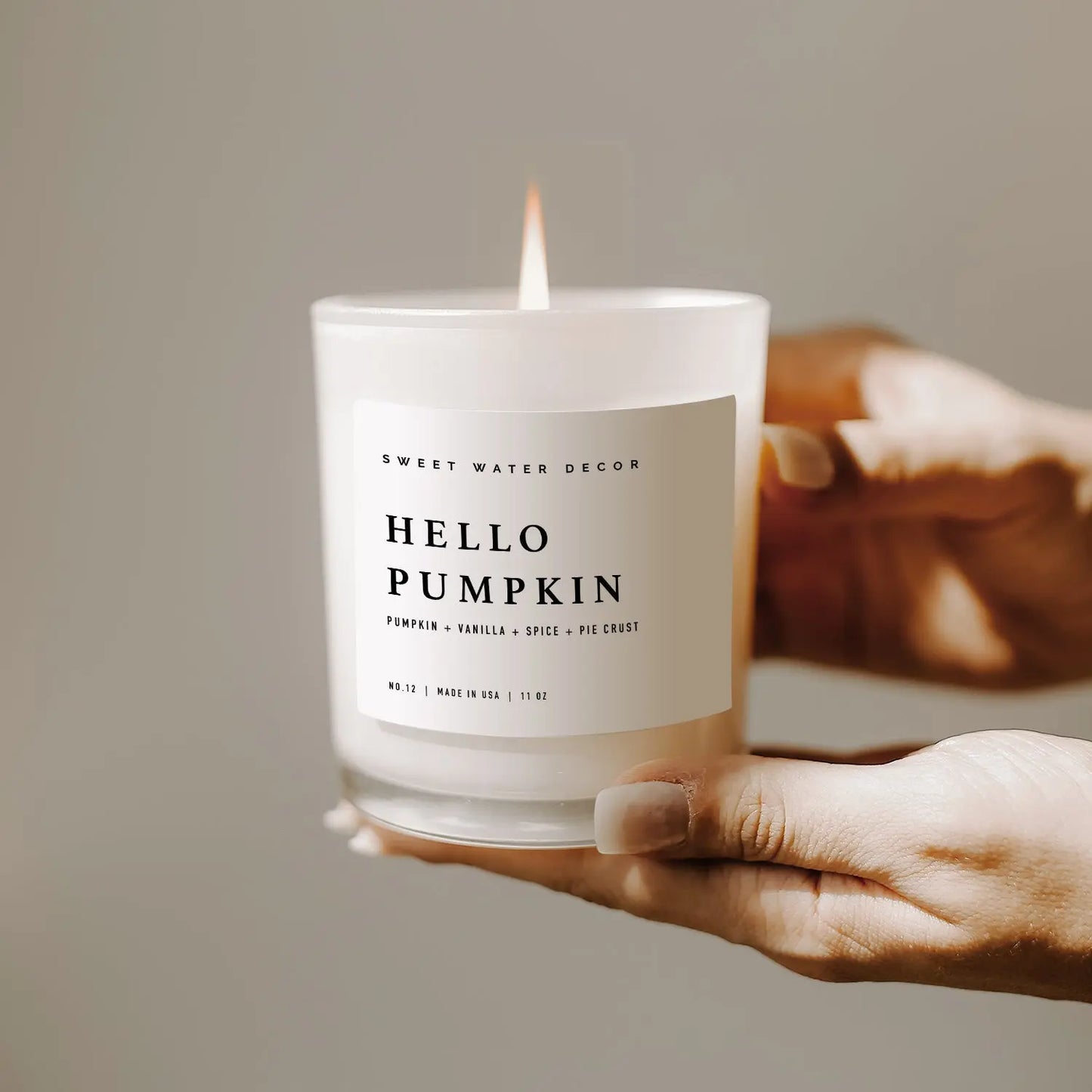 white hello pumpkin candle